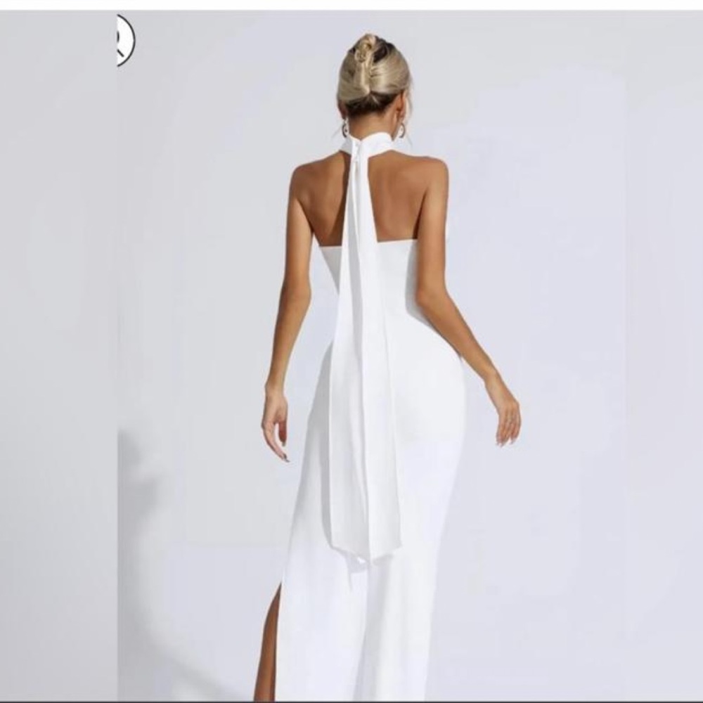 Brand new with tags size small white dress Split on the side Flowers on the neck